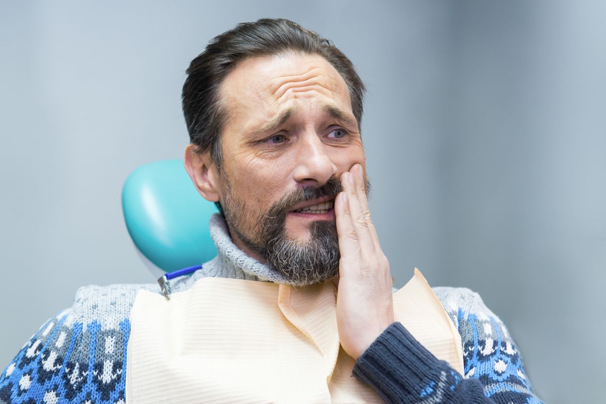 Patient discussing common problems with all on 4 dental implants Phoenix oral surgeon